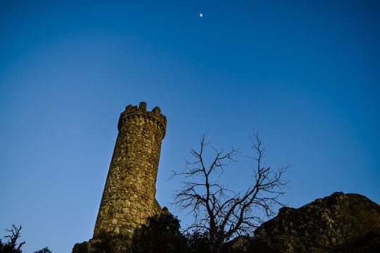 Looking from below the watchtower of Torrelodones feeling terror. Photography made in Torrelodones, Madrid (Spain)