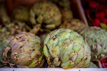 Fototapeta premium selective focus of artichokes on blurred background