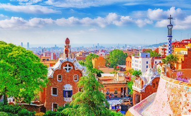 Spain, Barcelona. Fantastic view on Barcelona city over Park Guell, famous and popular landmark and travel destination in Europe. - obrazy, fototapety, plakaty