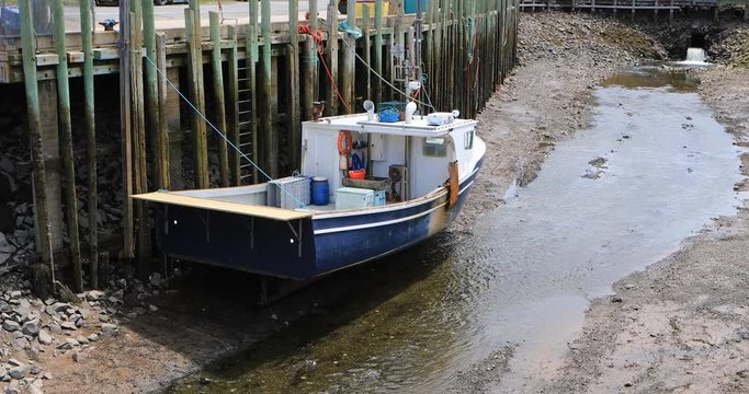 View of Halls Harbour boat at low tide 4K