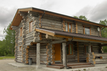 The house for rest from natural wood, dry logs.