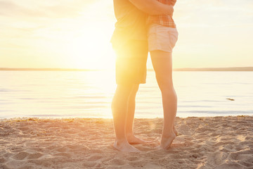couple happy on the beach legs sand sunset