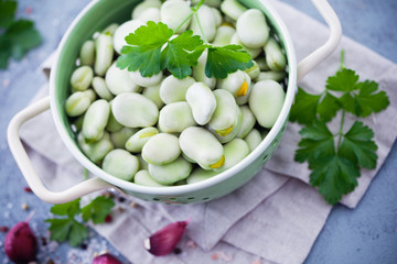 strainer full of fresh broad beans