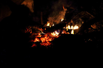 Night fire of a lonely traveller.  The fire is extinguished without fire wood...