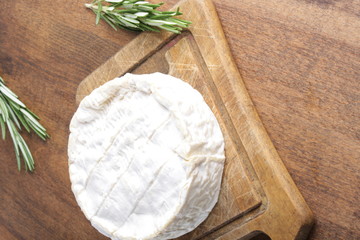 cheese brie on a wooden board