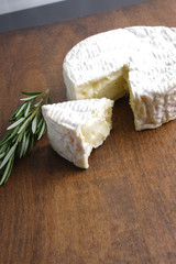 Camembert brie cheese on a wooden background