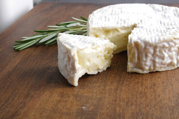 Camembert brie cheese on a wooden background