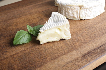 Camembert brie cheese on a wooden background