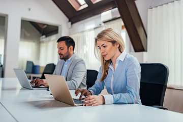 Two entrepreneurs working in an modern office.
