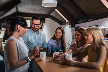 Coworkers having coffee break.