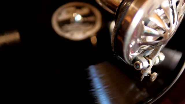 Swirling vinyl on old retro gramophone close-up