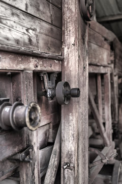 Right side of an old steam engine operated wooden made tresher in Csernat, Transylvania, Romania