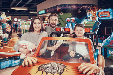 Happy family in amusement park