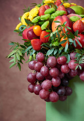 a beautiful bouquet of fruits and flowers for the birthday of strawberries grape peaches