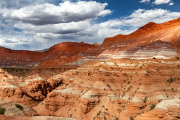 Gorgeous view of the many colored layers of sandstone in Grand Staircase-Escalante National Monument with cloud shadows in Paria, Utah USA.