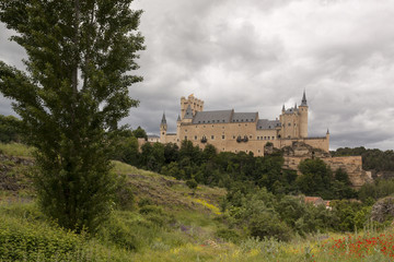 Fototapeta na wymiar Alcazar de Segovia next to the Templar church of Vera Cruz. Spring scene Castilla y Leon, Spain. Europe 