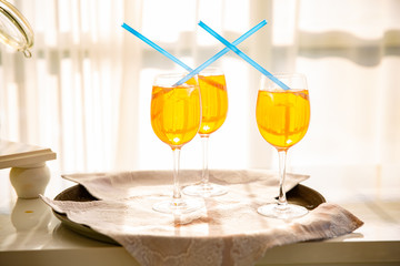 Fresh cocktail with orange, mint and ice, selective focus