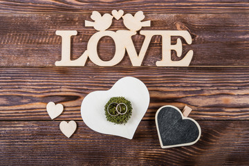 Hearts, love, Valentine's Day on a dark wooden rustic background
