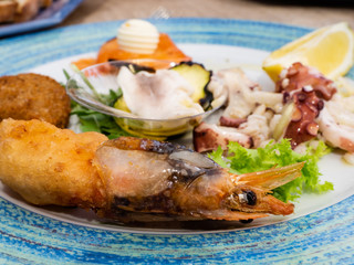 a tasty mixed appetizer of fresh fish with shrimp
