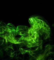 Green smoke on black background