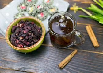Hibiscus thea from rose carcade on a dark background.
