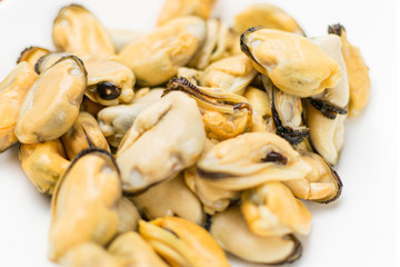 Peeled mussels on a white background.