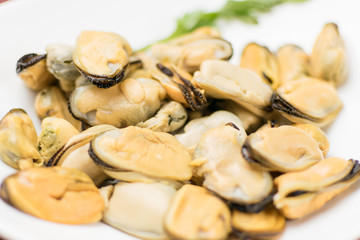 Peeled mussels on a white background.