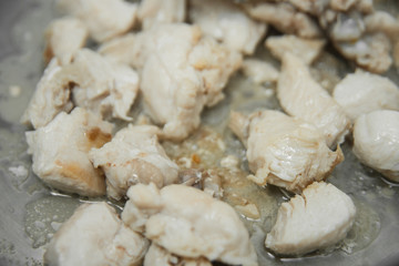 the meat is fried in a pan