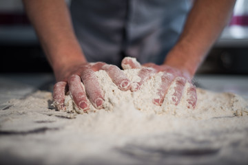 a man prepares the dough