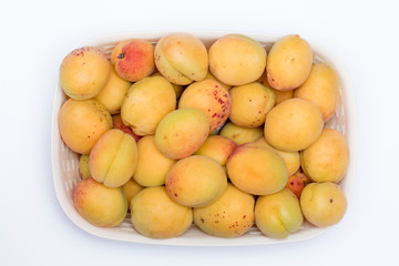 Naklejka na ściany i meble fresh apricots for background close-up (isolated on white background)