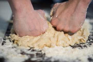 a man prepares the dough