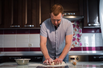 a man prepares the dough