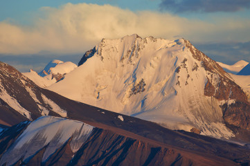 Close-up view of snow peaks at sunset. Ak-Shiyrak Range, Tien-Shan mountains, Kyrgyzstan. - 208963748