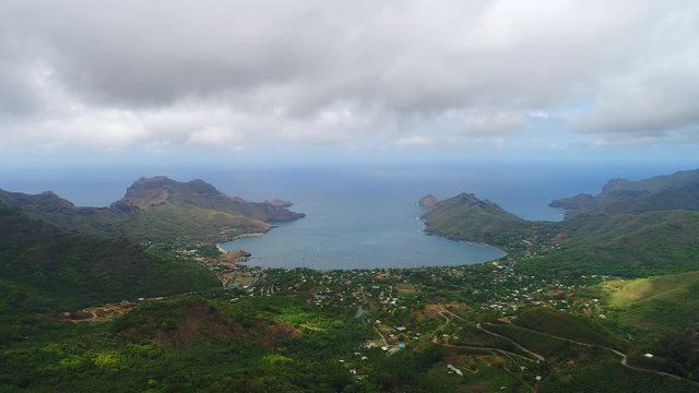 Aerial panoramic view of Taiohae bay on Nuku Hiva island, town of Taiohae - South Pacific Ocean, Marquesas Islands, landscape of French Polynesia from above, 4k