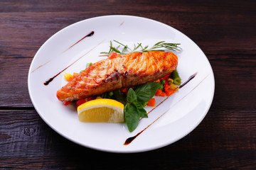 Grilled salmon steak with vegetable garnishing