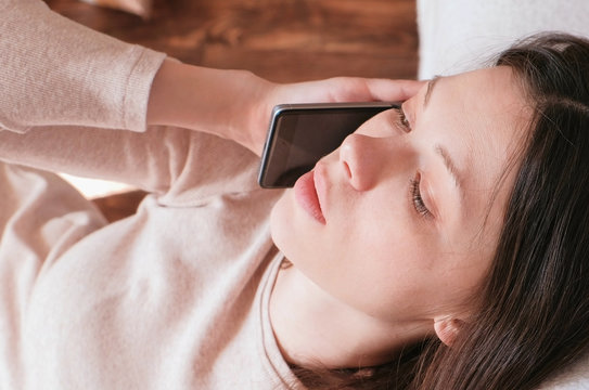 Young Beautiful Woman Is Speaking Mobile Phone And Relief Getting Off The Phone.