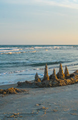 Sand Castle Dreams and Beach Memories made here. From family creations in the sand to comical headstones with a scary sand hand rising from the ocean floor, vacation memories start at the beach.