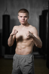 Fototapeta na wymiar Young boxer in readiness