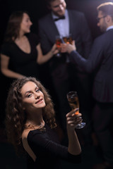 stylish young woman with glass of champagne