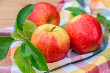 Red and yellow ripe apples Gala sort on the kitchen towel