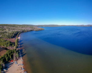 Aerial view of a big lake and the beach (Lac Normand), Reserve Saint-Maurice, Quebec Canada