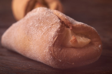 fresh pies with cottage cheese from a yeast dough on a wooden desk, baking with cottage cheese. Concept of small business bakery