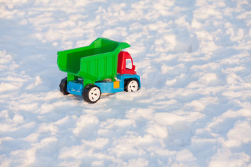 Colour toy truck on the snow