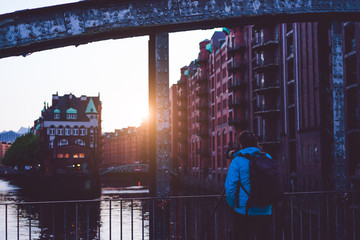 Photograph capture sunset on massive steel construction of Poggenmoehlenbruecke bridge near the Wasserschloss Hamburg Hafencity