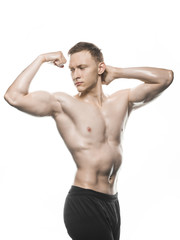 Fototapeta premium man bodybuilder showing muscular body on white background