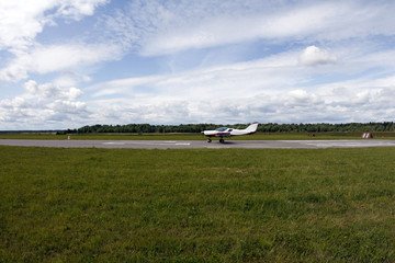 A small airplane on the runway.