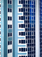 Modern building architecture glass window blue white background photo