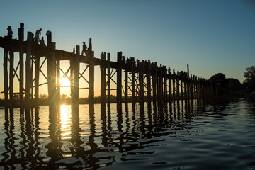 U Bein Bridge, Amarapura, Myanmar - view of this famous bridge during the sunset at Taung Tha Man Lake