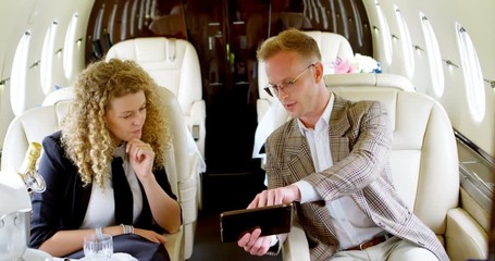 Business people discussing over digital tablet 4k - Powered by Adobe