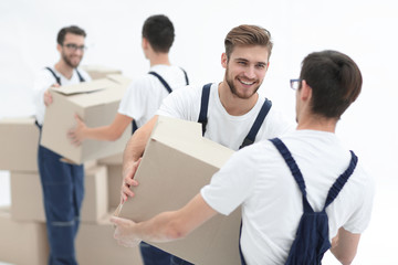 Fototapeta na wymiar Portrait of movers holding box smiling isolated on white backgro